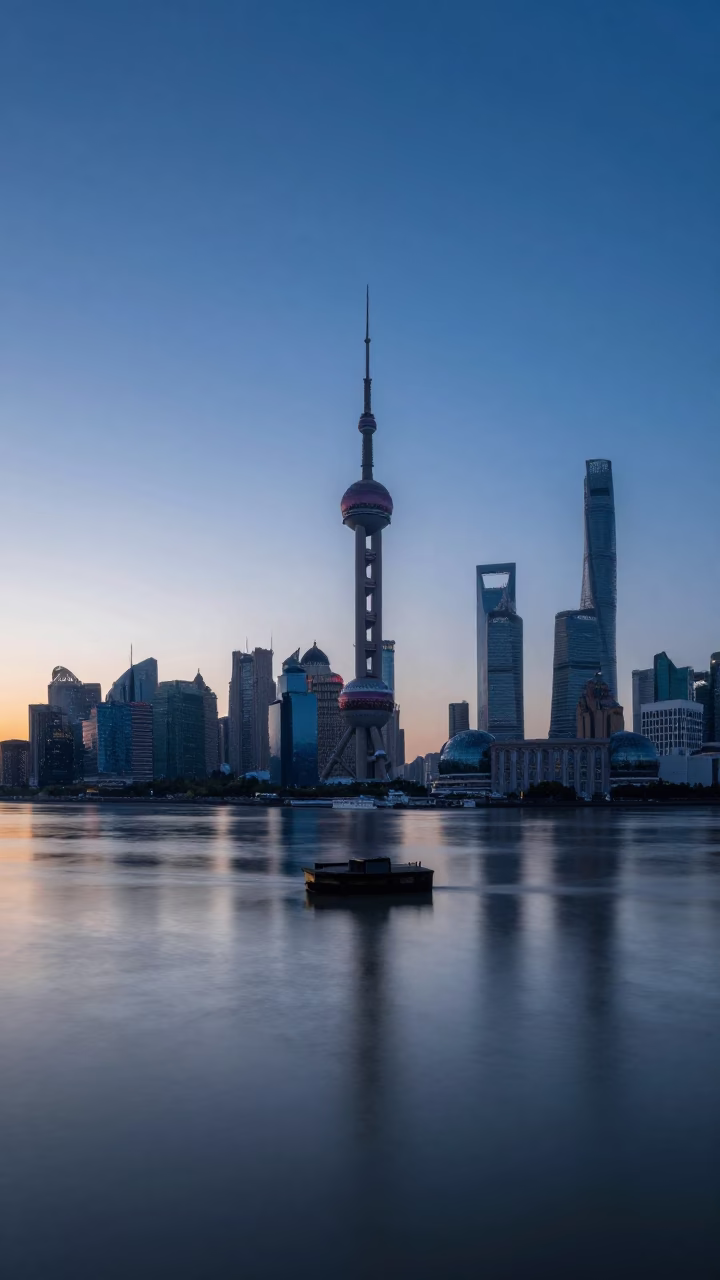 Dawn light on Huangpu River with Shanghai skyline and bridge pier reflection in in Shanghai, China