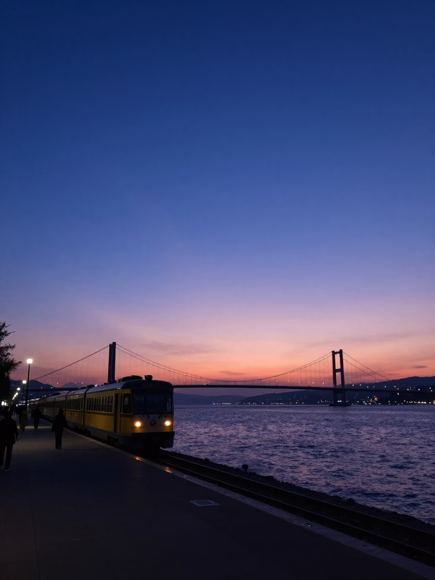 Dawn Light on Izmir Bay Promenade with Commuter Train and Glass Bench in in Izmir, Turkey