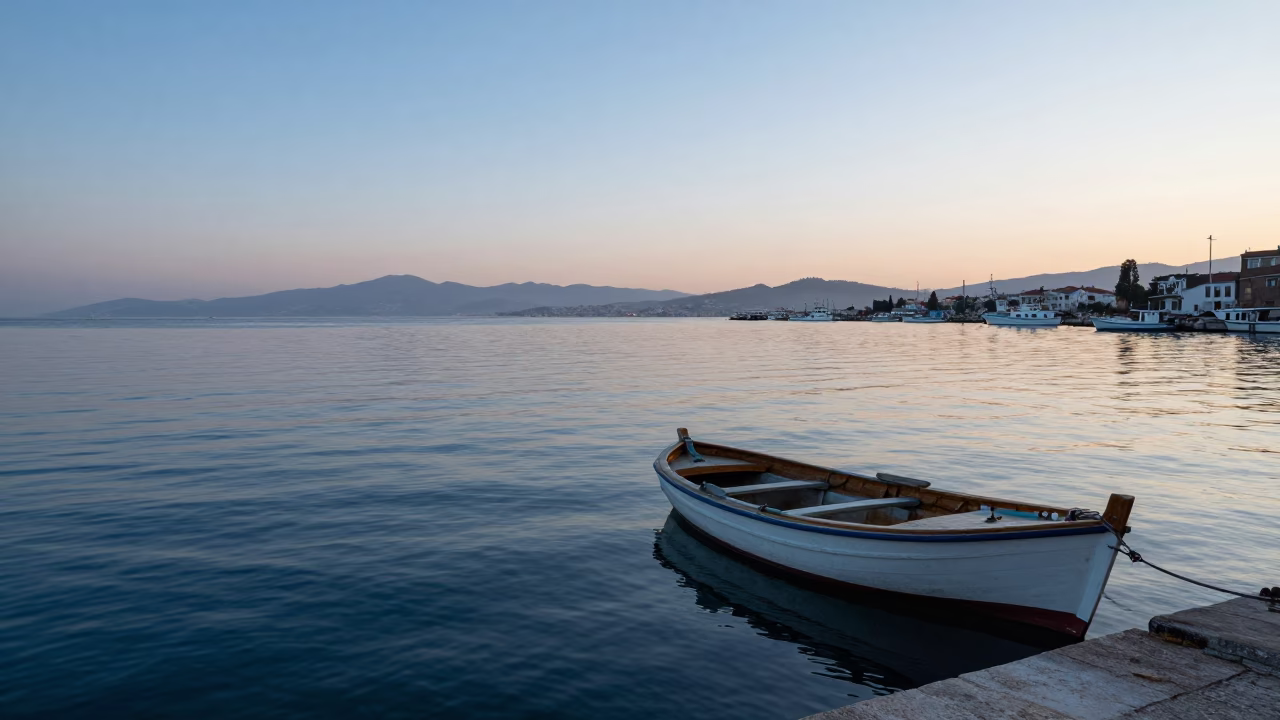 Dawn Light on Izmir Harbor with Fishing Boat and Coastal Architecture in in Izmir, Turkey