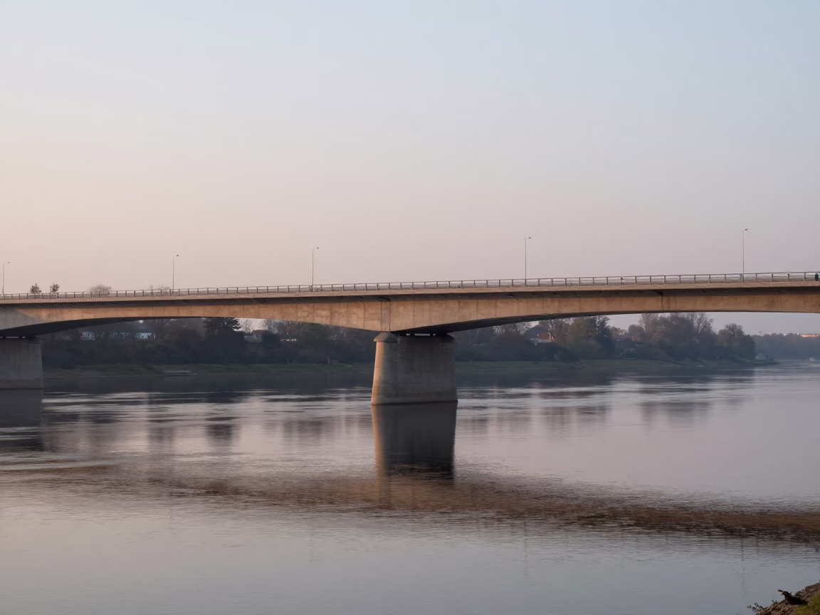 Dawn Light on Krakow Bridge Pier and River Water Before Sunrise in in Krakow, Poland