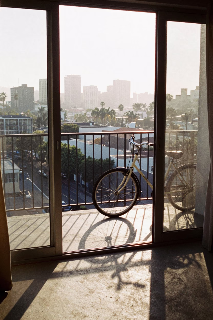 Dawn Light on Los Angeles Balcony with Bicycle Wheel and Graduation Gown in in Los Angeles, California, United States