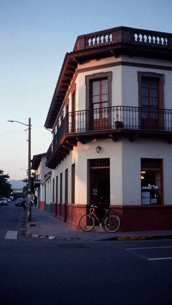 Dawn Light on Medellín Colombia Street with Bicycle and Bakery Exterior in in Medellin, Colombia