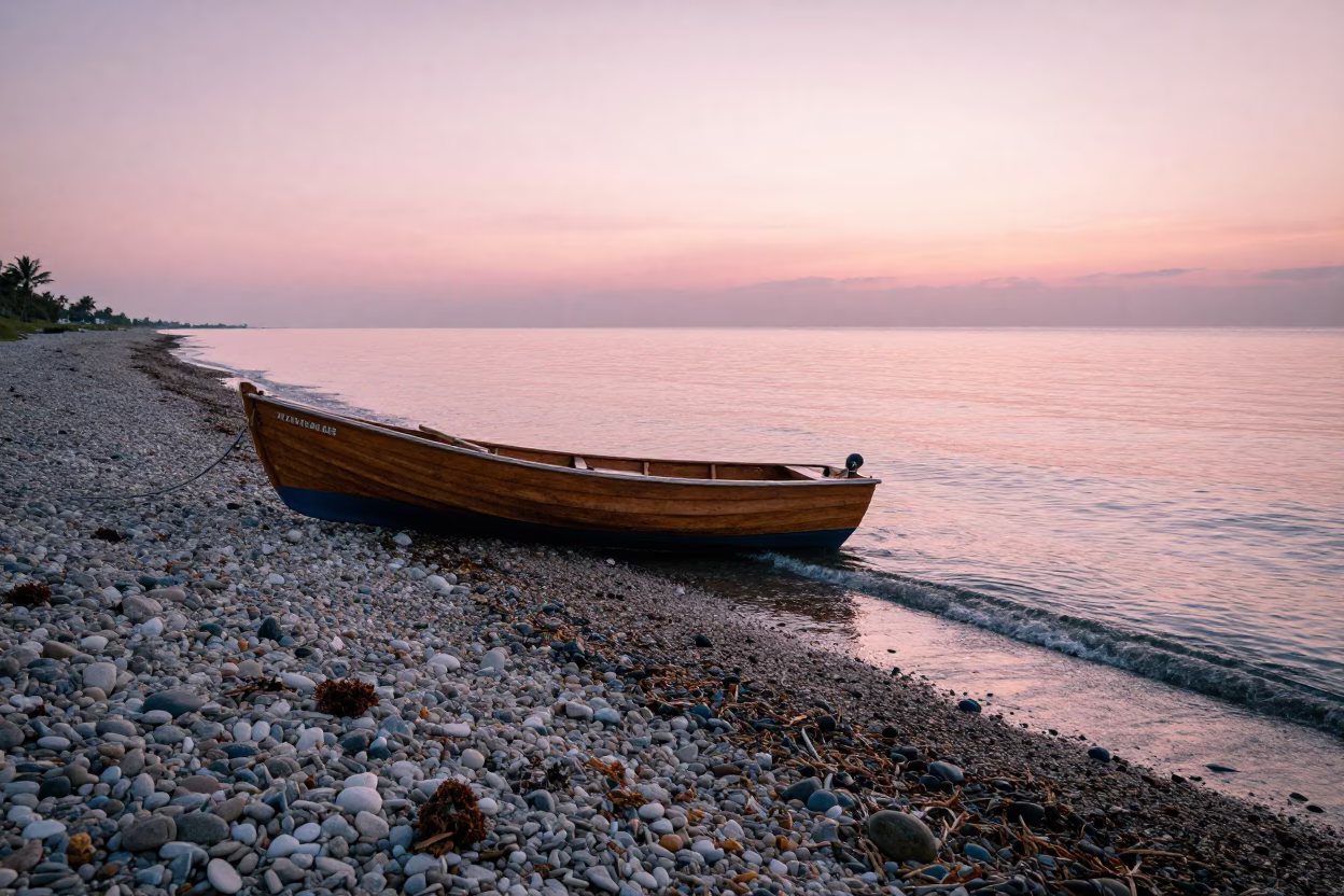 Dawn Light on Miami Beach Rowboat and Pebbles at First Light in in Miami, Florida, United States