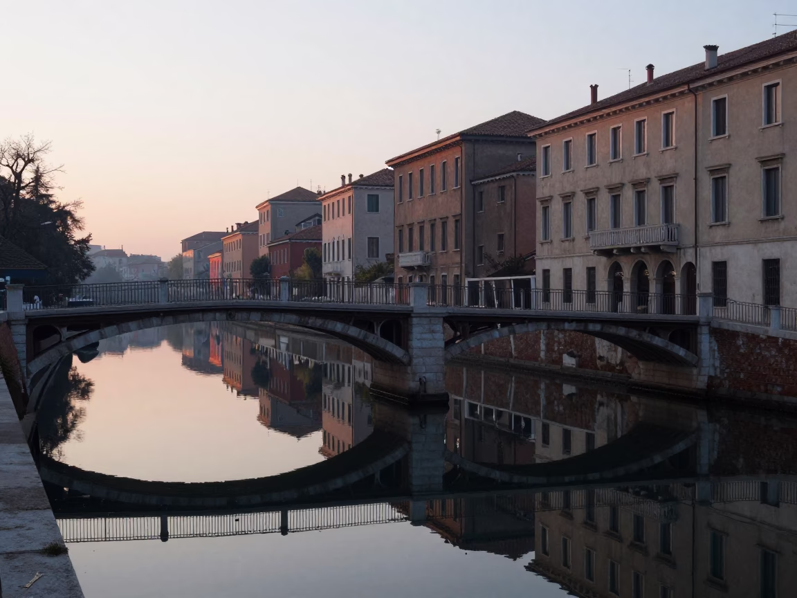Dawn Light on Milan Bridge Pier and Mirror-Still Dawn Water Before Sunrise in in Milan, Italy