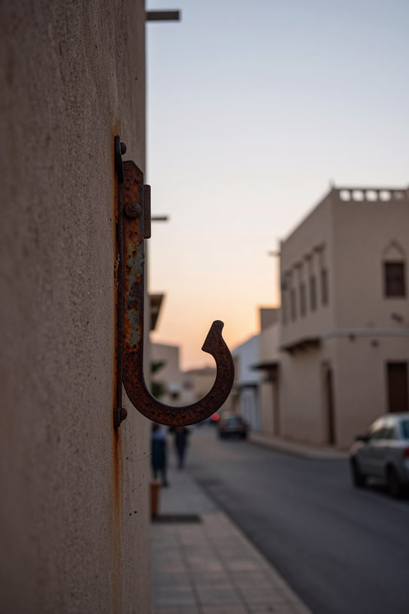 Dawn Light on Muscat Street with Rusty Hook Plate and Traditional Bread Oven in in Muscat, Oman