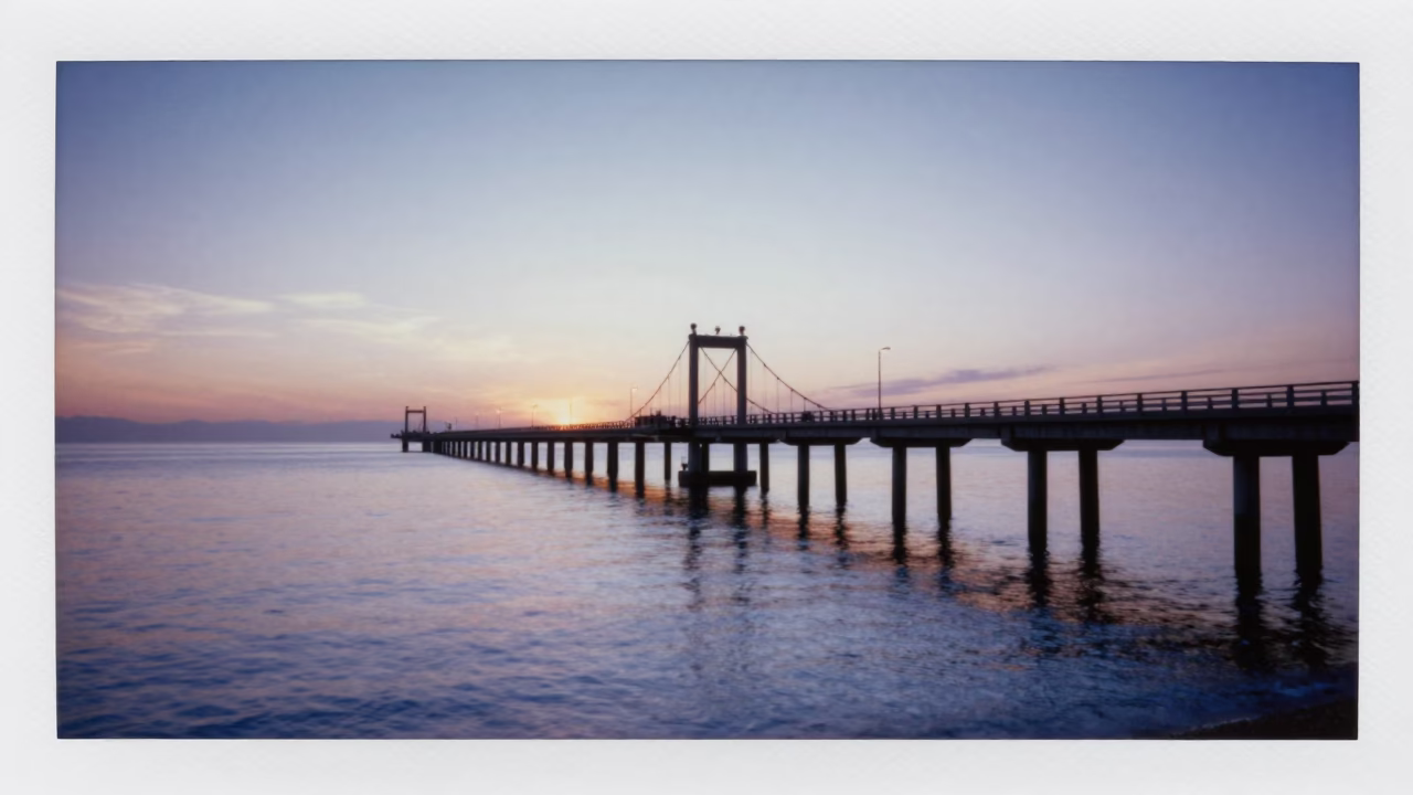 Dawn Light on Nice Harbor Bridge Pier and Calm Mediterranean Waters in in Nice, France