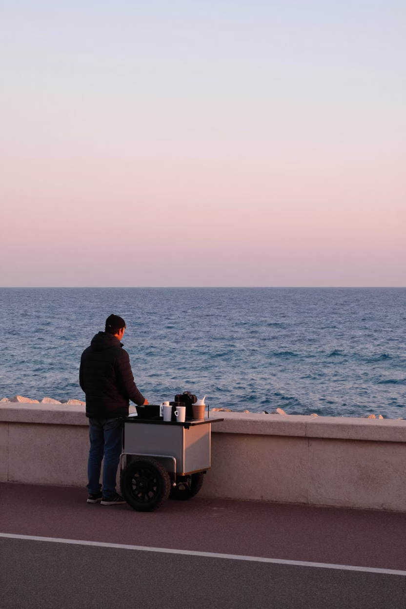 Dawn Light on Nice Promenade with Coffee Vendor and Coastal Views in in Nice, France
