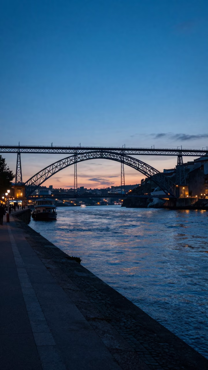 Dawn Light on Porto's Ribeira Quayside with Steam Rising from Coffee Cups in in Porto, Portugal