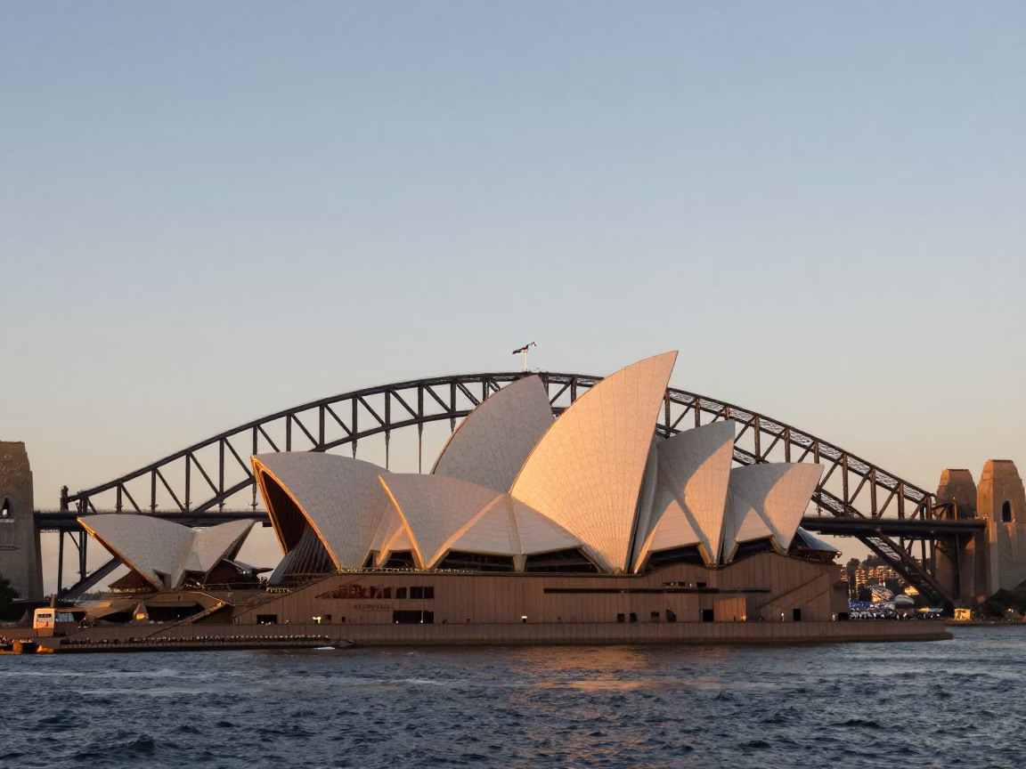 Dawn Light on Sydney Harbour Bridge and Opera House with Morning Commute in in Sydney, New South Wales, Australia