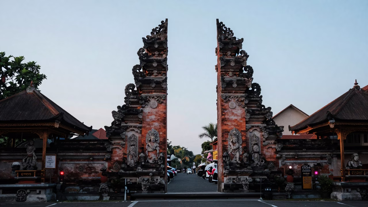 Dawn light on traditional Balinese temple gates in Denpasar Indonesia street scene in in Denpasar, Indonesia