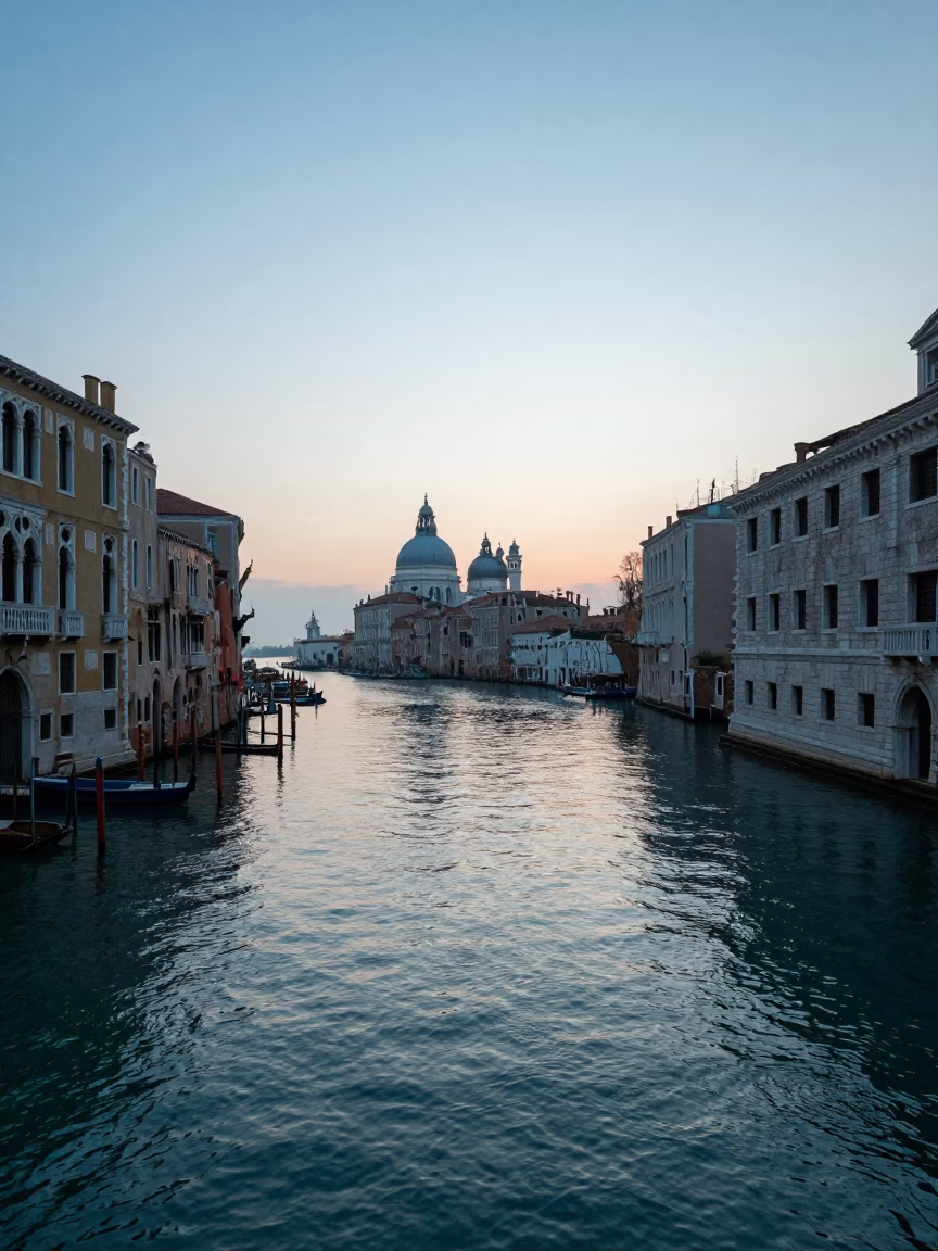 Dawn Light on Venice Canal with Stone Bridges and Water Reflections in in Venice, Italy
