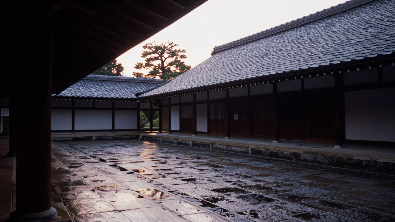 Dawn Light on Wet Flagstones in Kyoto University Cloister with Stone Lanterns in in Kyoto, Japan