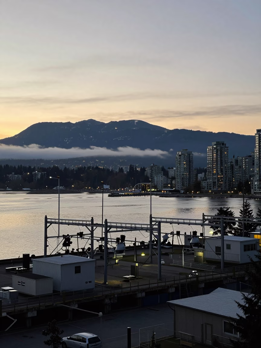 Dawn Light Over Vancouver Harbour with Substation Infrastructure and Coastal Cedar Trees in in Vancouver, British Columbia, Canada