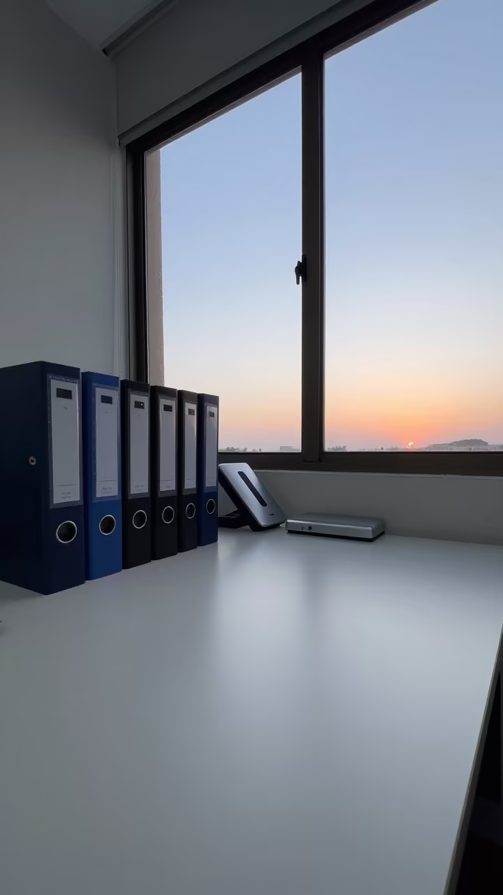 Dawn Light on Policy Binders in Lubango Office in inside a coworking floor in Lubango