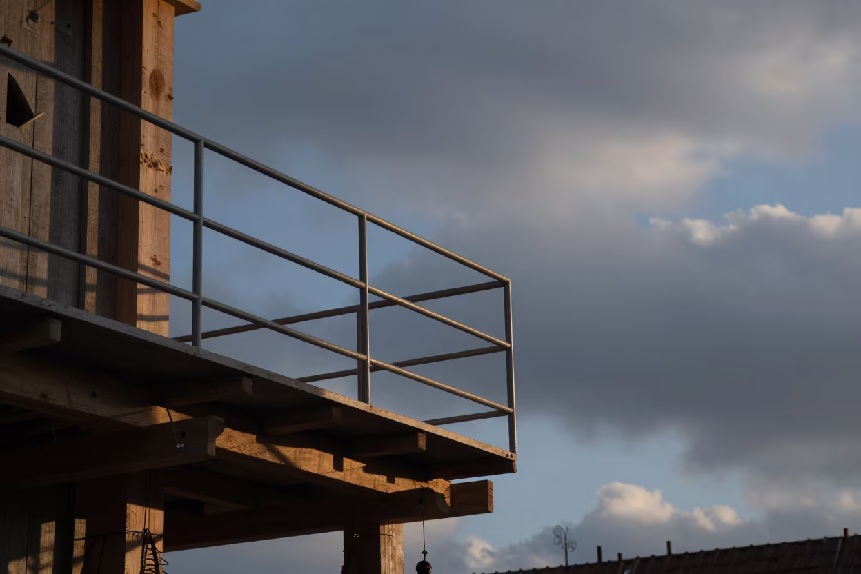 Dawn Light Safety Rail Construction Site Riga in beside a framed building shell near Old Town, Riga