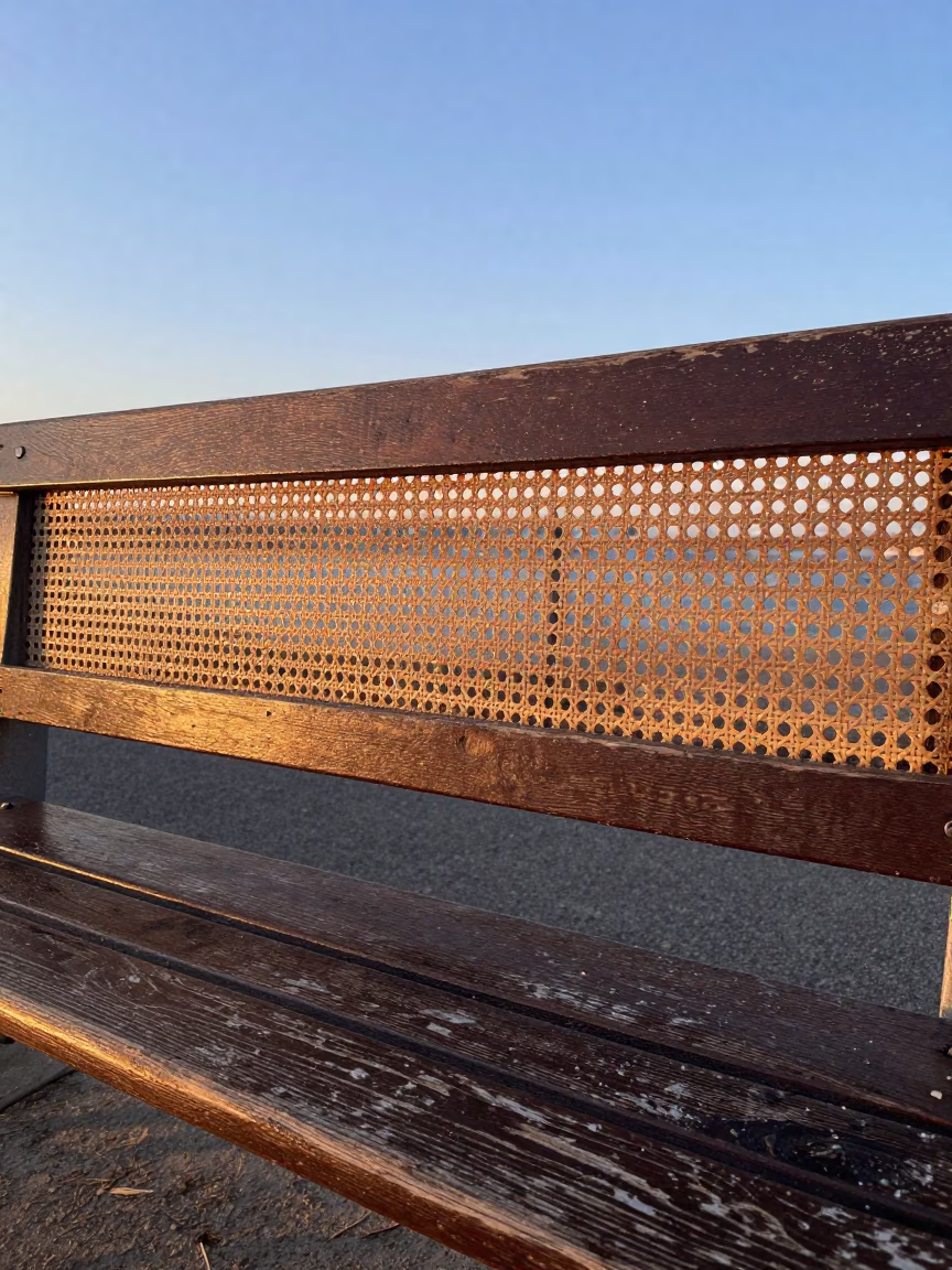 Dawn Light Through Woven Cane on Marseille Street Bench with Scarf and Paint Flecks in in Marseille, France