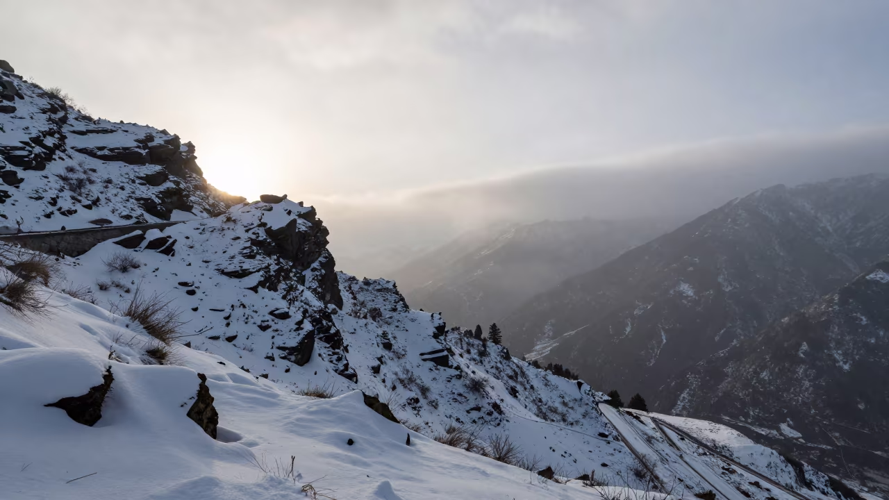 Dawn Mist Over Rocky Mountain Pass Near Thimphu in at a rocky saddle overlooking a mountain valley near Thimphu