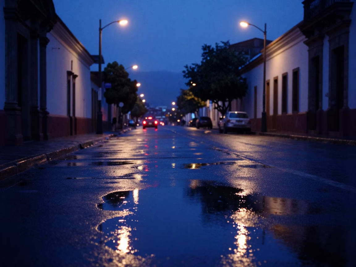 Dawn Street Scene in Quito Ecuador Puddle Reflections and City Lights Before Sunrise in in Quito, Ecuador