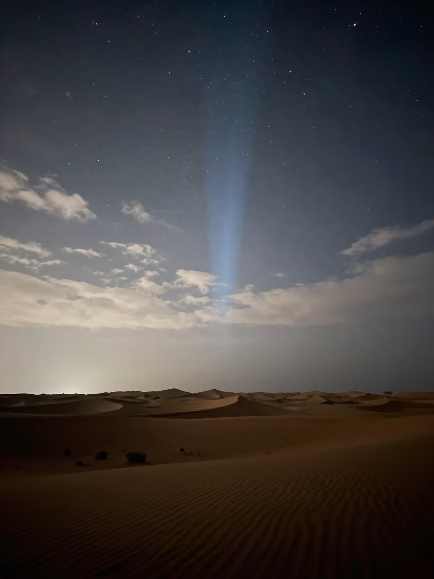 Dawn Zodiacal Light Over Muscat Desert Escarpment in beneath a wind-cut desert escarpment near Muscat