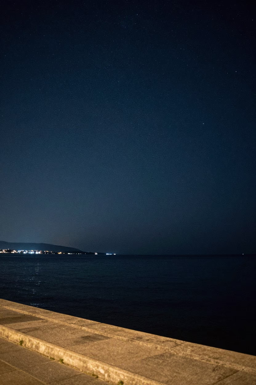 Deep Night Horizon View of Izmir Bay From Kordon Promenade Under Starry Turkish Sky in in Izmir, Turkey