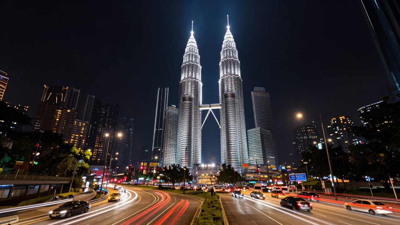 Deep Night Kuala Lumpur Highway Traffic Light Trails Petronas Towers Background in in Kuala Lumpur, Malaysia