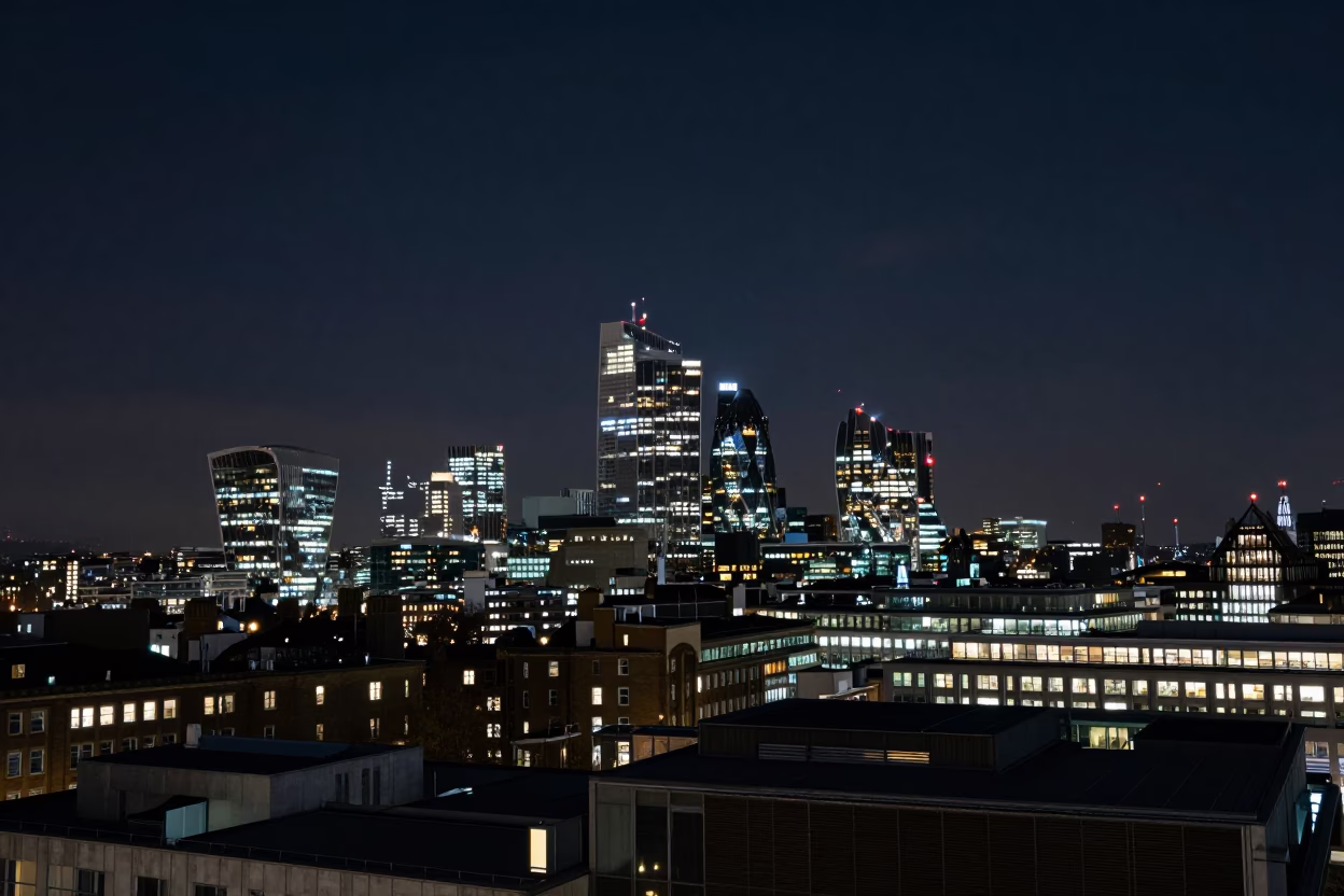 Deep Night London Skyline View Over Urban Rooftops and Distant City Lights in in London, United Kingdom