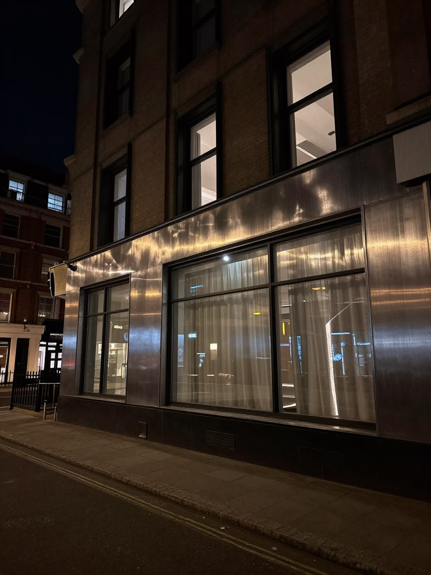 Deep Night London Street Scene with Brushed Steel Window Glass Reflections and Urban Architecture in in London, United Kingdom