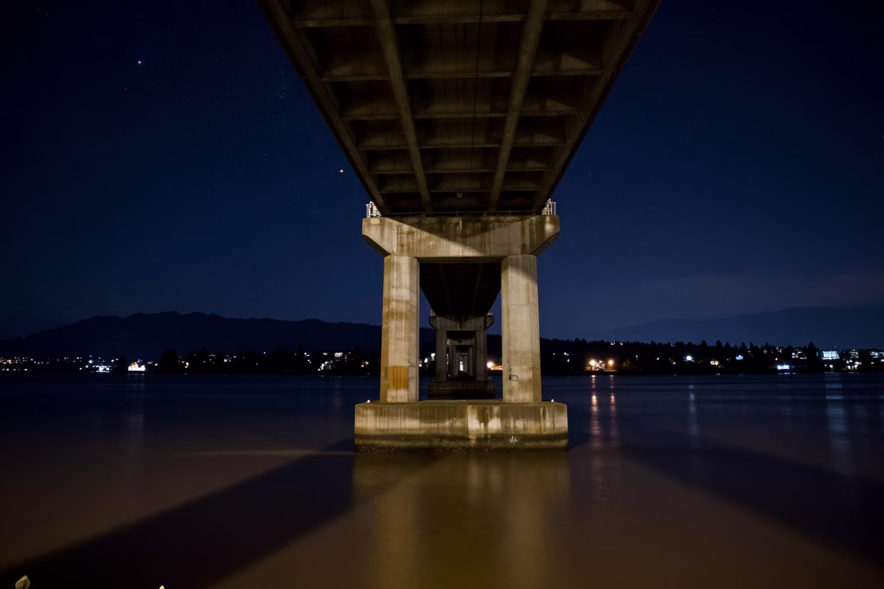 Deep Night Sky Over Vancouver Bridge Pier And Floodwater In British Columbia in in Vancouver, British Columbia, Canada