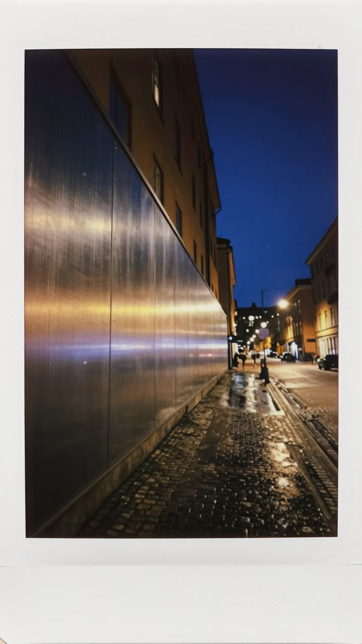 Deep Night Stockholm Street Scene with Brushed Steel Wall and Tram in in Stockholm, Sweden