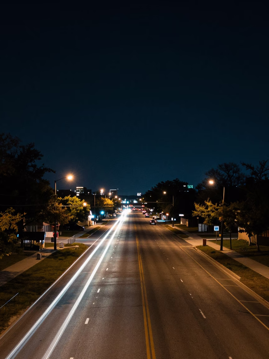 Deep Night Street Scene in Austin Texas With Highway Light Trails and Local Activity in in Austin, Texas, United States
