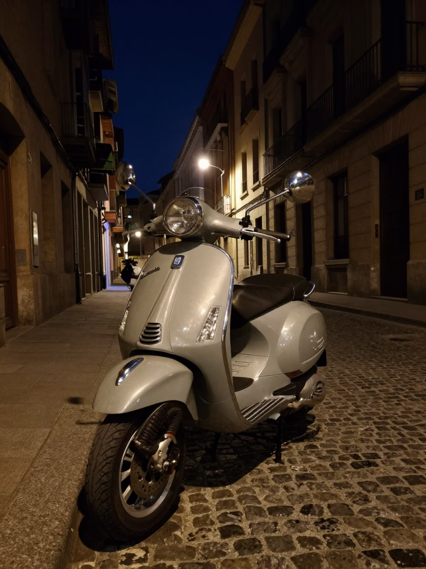 Deep Night Street Scene in Bilbao Spain with Vintage Vespa on Cobblestones in in Bilbao, Spain