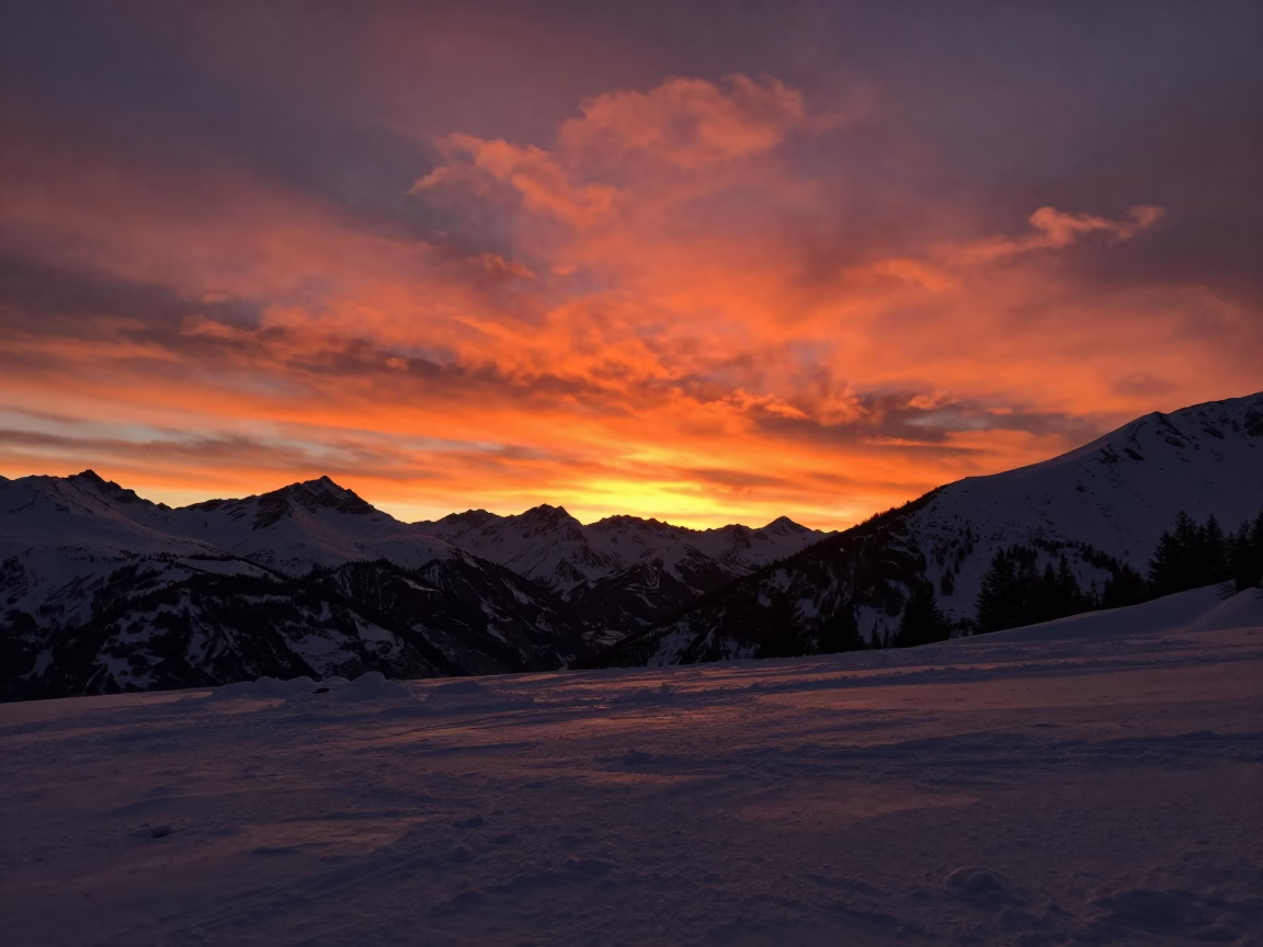 Deep Orange Volcanic Sunset Over Tyrol Winter in in Tyrol