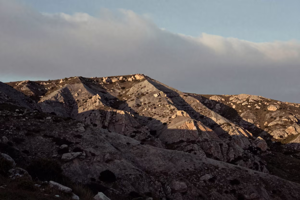 Deep Shadowed Sardinian Foothills Before Sunrise in from a ridge above layered foothills in Sardinia