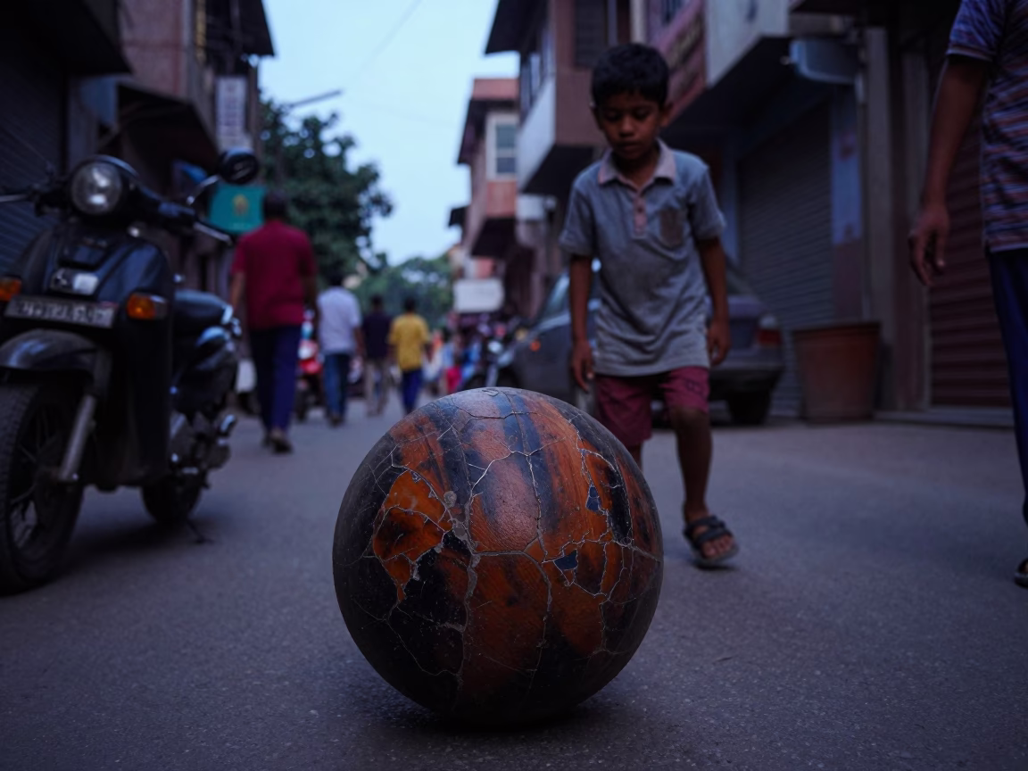 Delhi India Twilight Street Scene with Child and Old Leather Basketball Near Residential Building in in Delhi, India