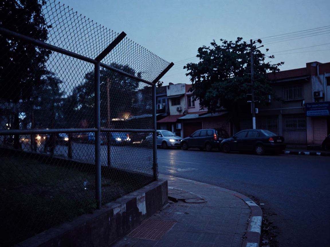 Delhi Indigo Twilight Street Scene with Substation Fence and Warning Placards in in Delhi, India