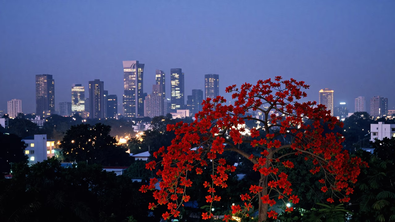Delhi Skyline at Twilight with Red Flame Tree Bloom and City Lights in in Delhi, India