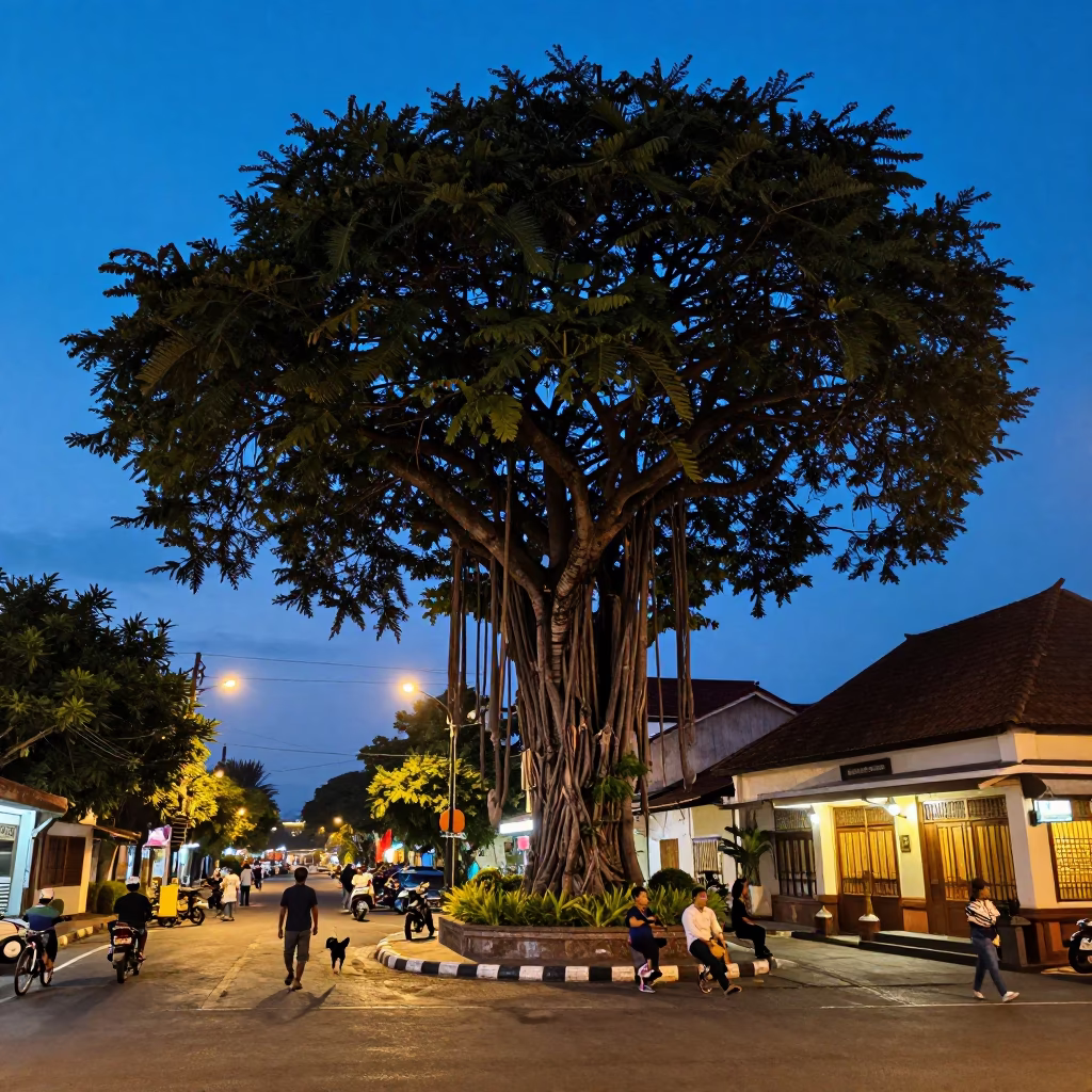 Denpasar Indonesia Blue Hour Street Scene with Banyan Tree and Local Life in in Denpasar, Indonesia