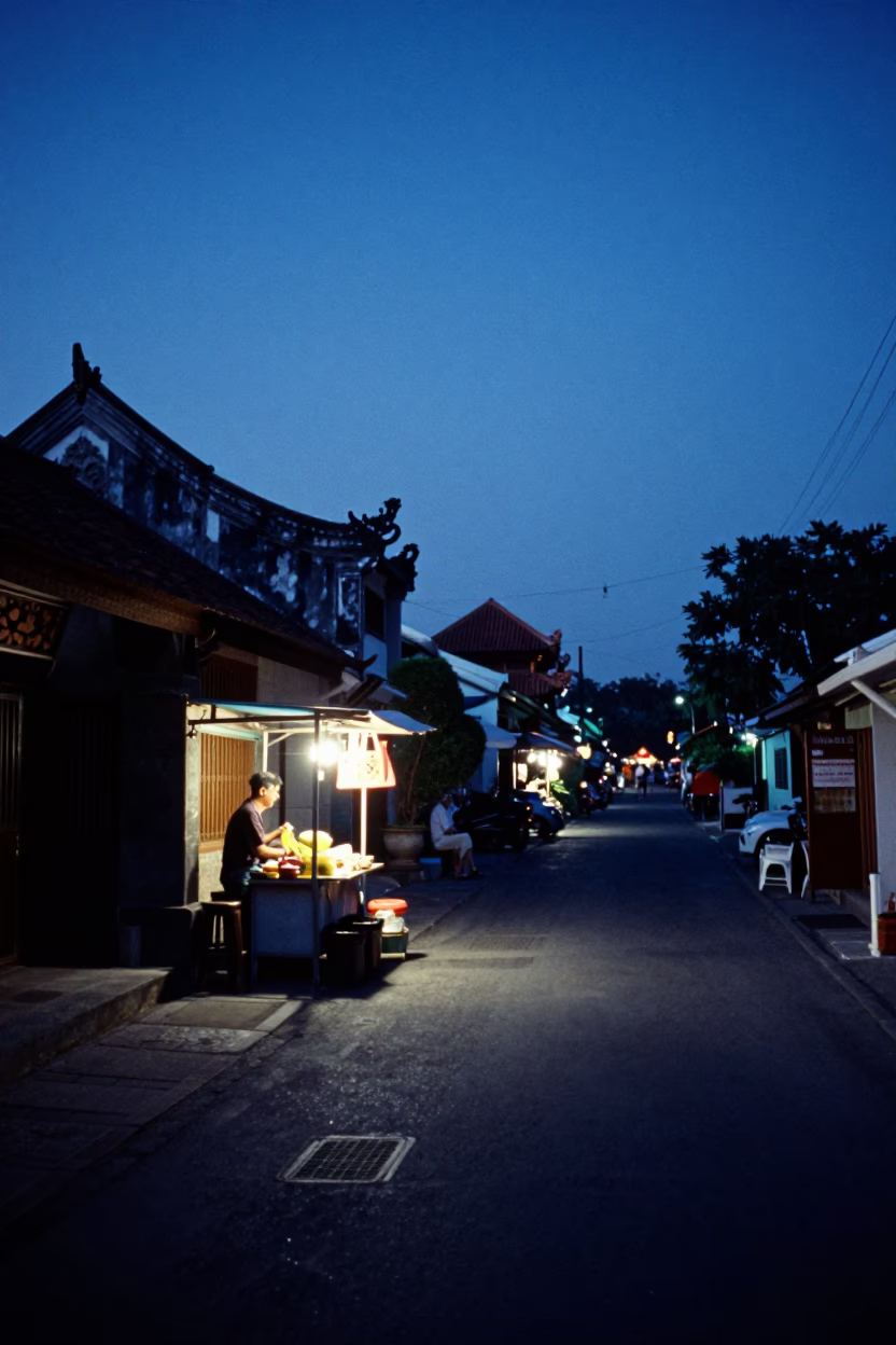Denpasar Indonesia indigo twilight street scene with traditional architecture and local life in in Denpasar, Indonesia