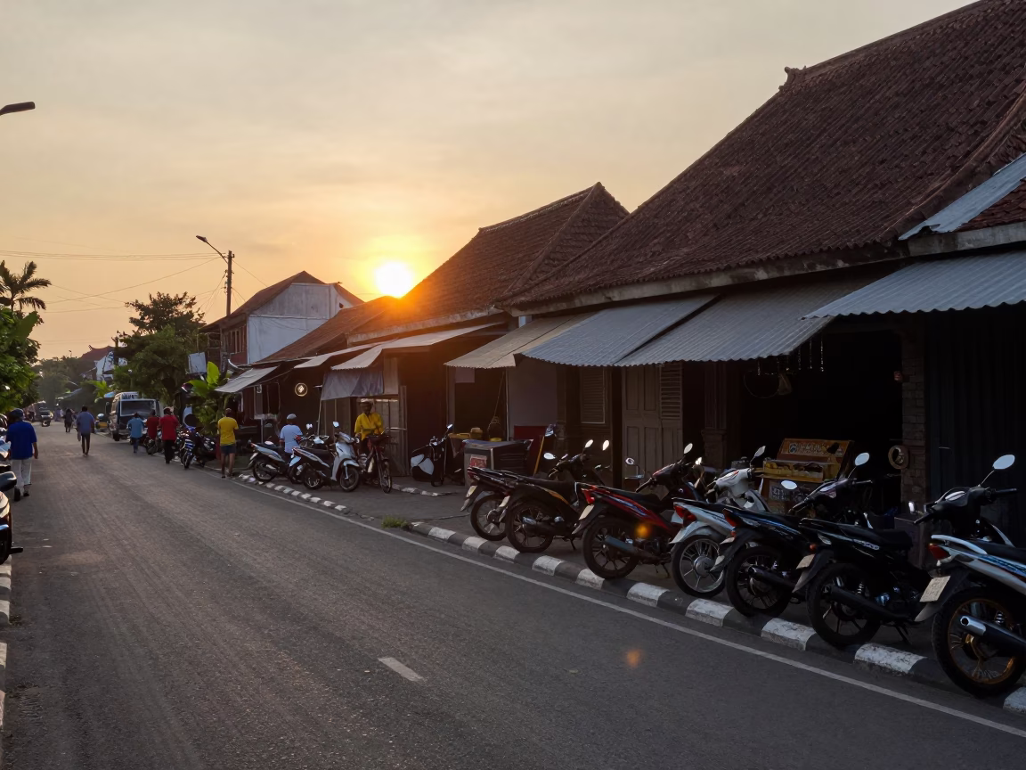 Denpasar Indonesia Street Scene at Sunset with Motorbikes and Traditional Architecture in in Denpasar, Indonesia