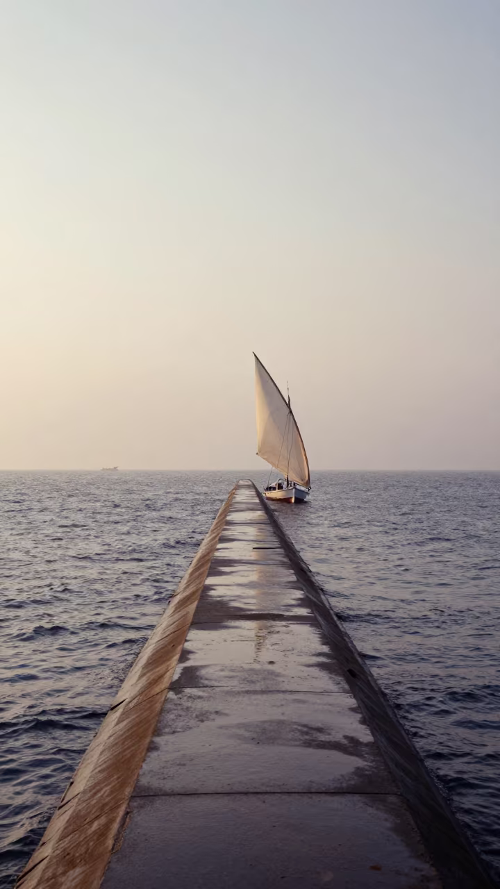 Dhow Racing Sail on Thai Causeway Dawn Mist in on a wind-open causeway in Thailand