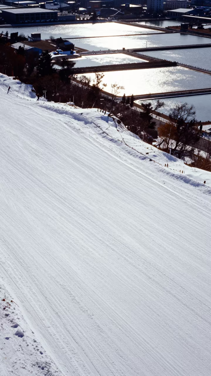 Diagonal Ski Tracks on Powder Near Beijing Salt Ponds in high over salt ponds and causeways near Sanlitun, Beijing