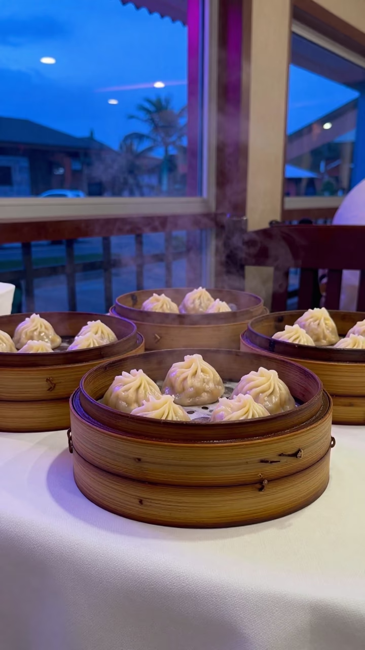 Dim Sum Steamers in Mombasa Neon Light in on a linen-covered restaurant table in Mombasa