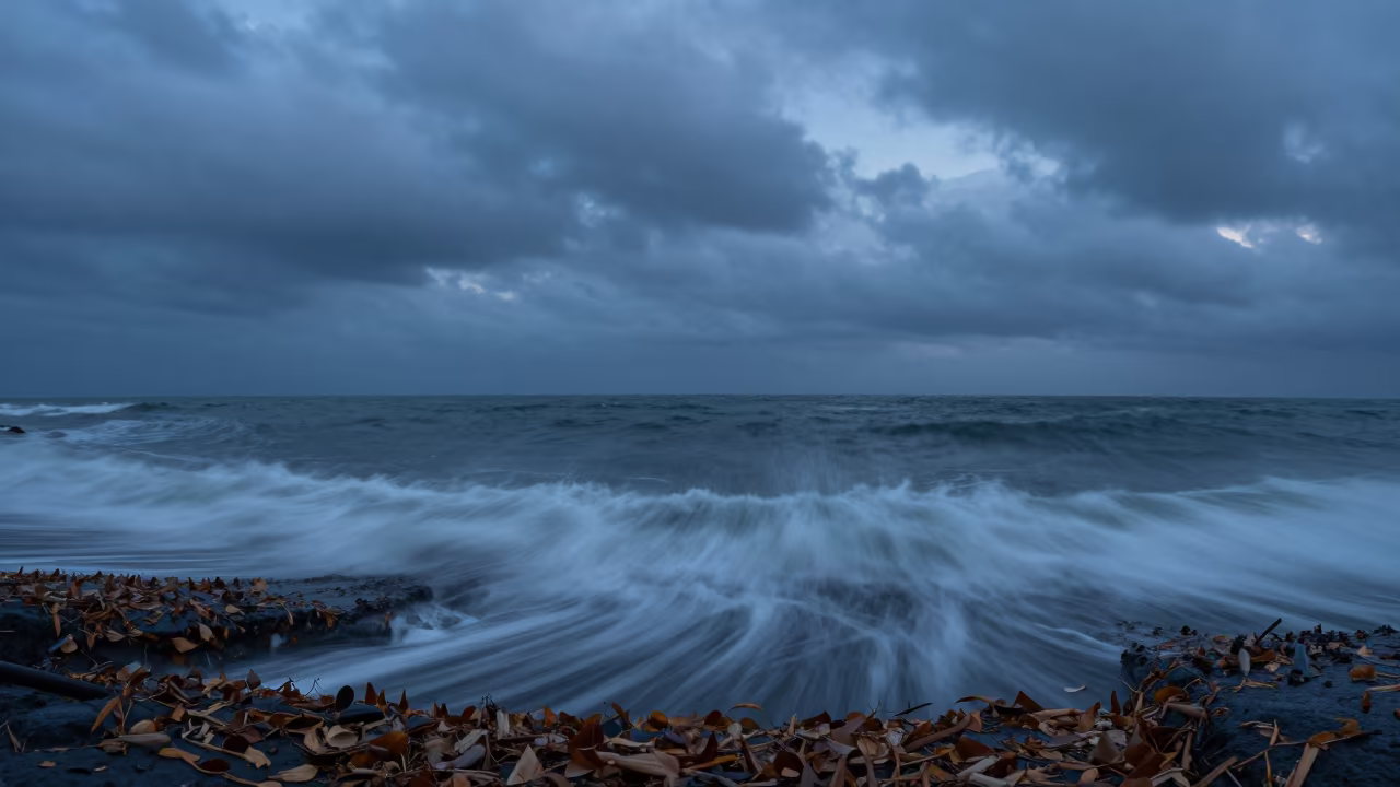Dissipating Waterspout Over Djibouti Bay in beneath fast-moving cloud bands in Djibouti