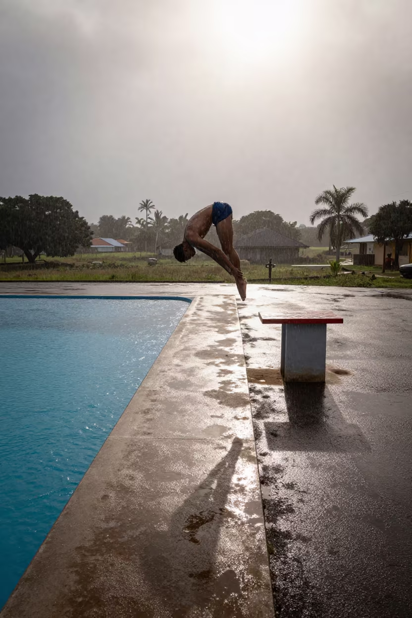 Diver in Pike Position Above Pool at Roadside Stop in at a roadside stop near Toamasina