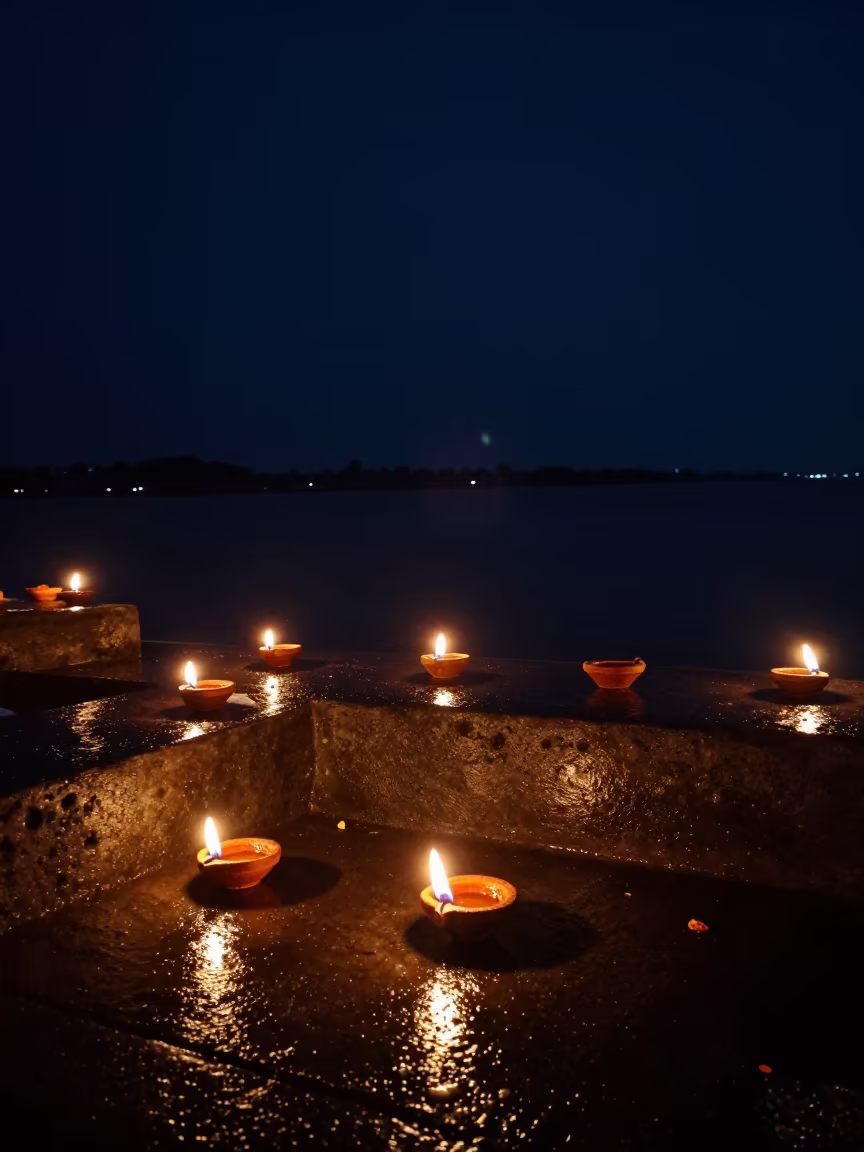 Diwali Oil Lamps on Wet Steps by Kolkata Waterfront in at a waterfront celebration near Park Street, Kolkata