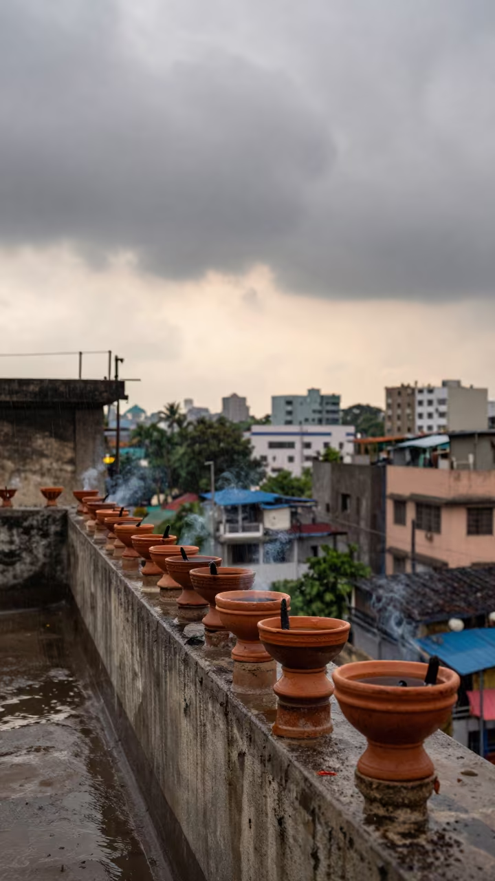 Diwali Rooftop Lamps After Rain in Dharavi in in a shrine lined with lanterns in Dharavi, Mumbai