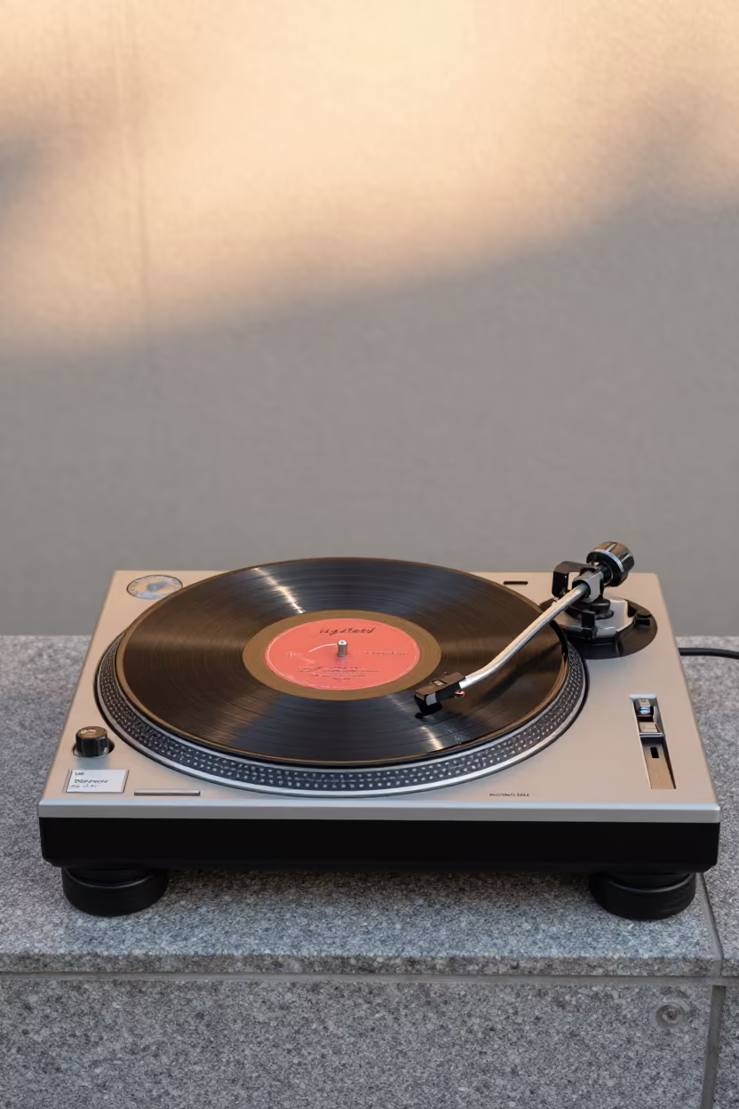 DJ Spinning Vinyl Backward on Stone Ledge Osaka in on a stone ledge near Nakazakicho, Osaka