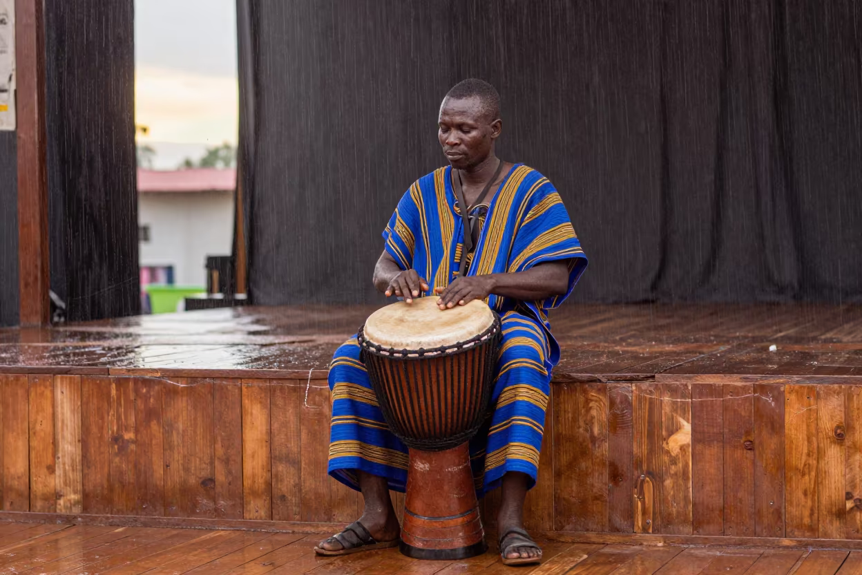Djembe Drummer at Dawn in San Pedro in on a theater stage in San-Pédro