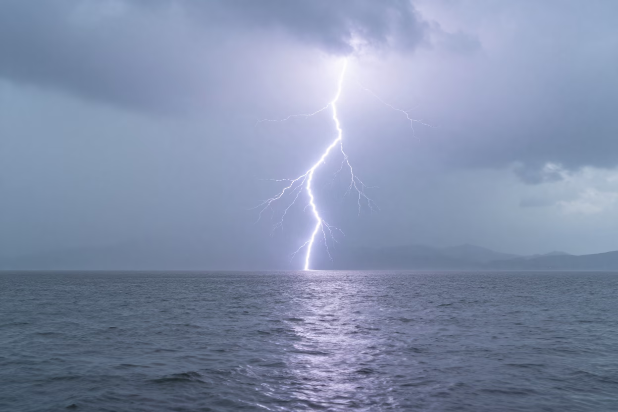 Double Exposure Lightning Over Rippled Lake Keelung in beneath fast-moving cloud bands near Keelung