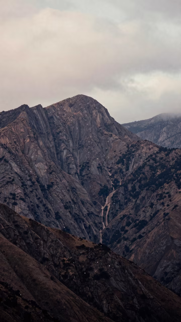 Double Exposure Stars Over Mountain Ridge at Sunrise in across a wide valley floor near Calle Jaen, La Paz
